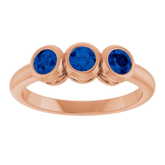 Round Lab-Grown Blue Sapphire Three Stone Ring in Rose Gold
