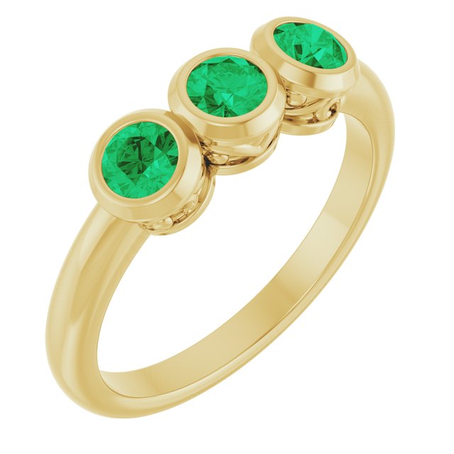 Round Emerald Three Stone Ring in Yellow Gold