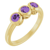 Round Amethyst Three Stone Ring in Yellow Gold