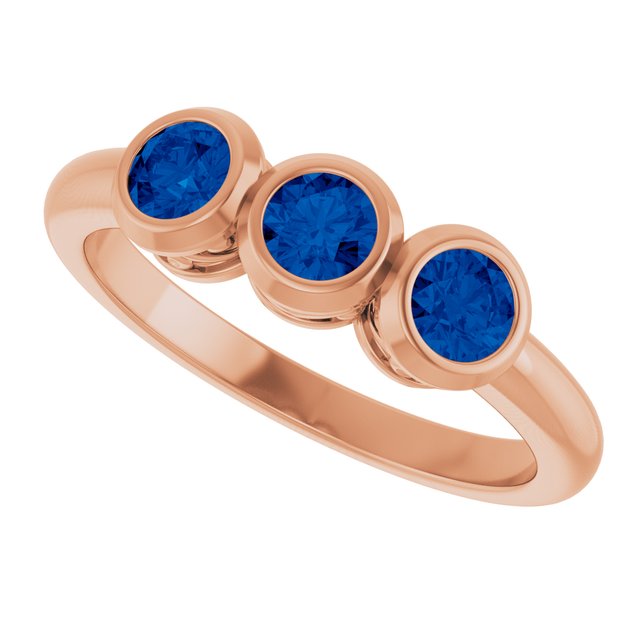 Round Lab-Grown Blue Sapphire Three Stone Ring in Rose Gold