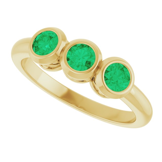 Round Emerald Three Stone Ring in Yellow Gold