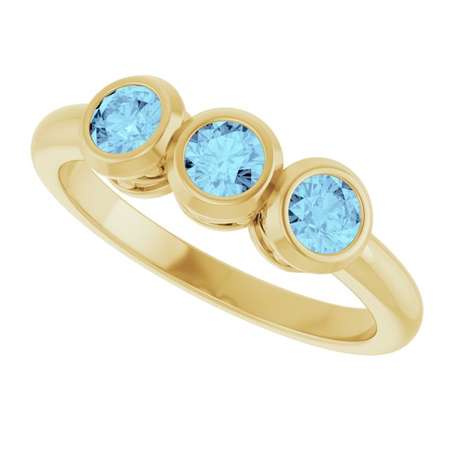Round Aquamarine Three Stone Ring in Yellow Gold