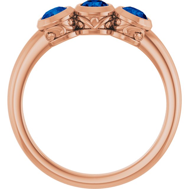 Round Lab-Grown Blue Sapphire Three Stone Ring in Rose Gold