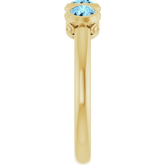 Round Aquamarine Three Stone Ring in Yellow Gold