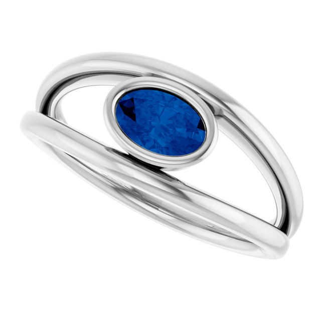 Oval Blue Sapphire Negative Space Ring in Gold and Platinum