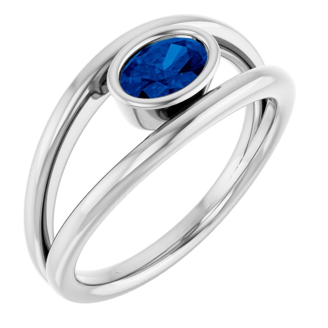Oval Blue Sapphire Negative Space Ring in Gold and Platinum