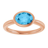 Natural Swiss Blue Topaz Rose Gold Solitaire Ring in | oval