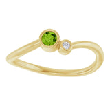 Round Peridot Two Stone Ring with Diamond Accents in Yellow Gold