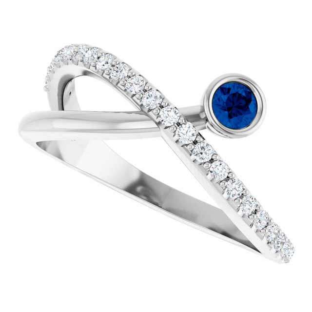 Round Blue Sapphire Accented Ring with Diamond Accents in Platinum