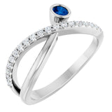 Round Blue Sapphire Accented Ring with Diamond Accents in Platinum