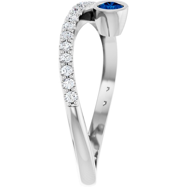 Round Blue Sapphire Accented Ring with Diamond Accents in Platinum