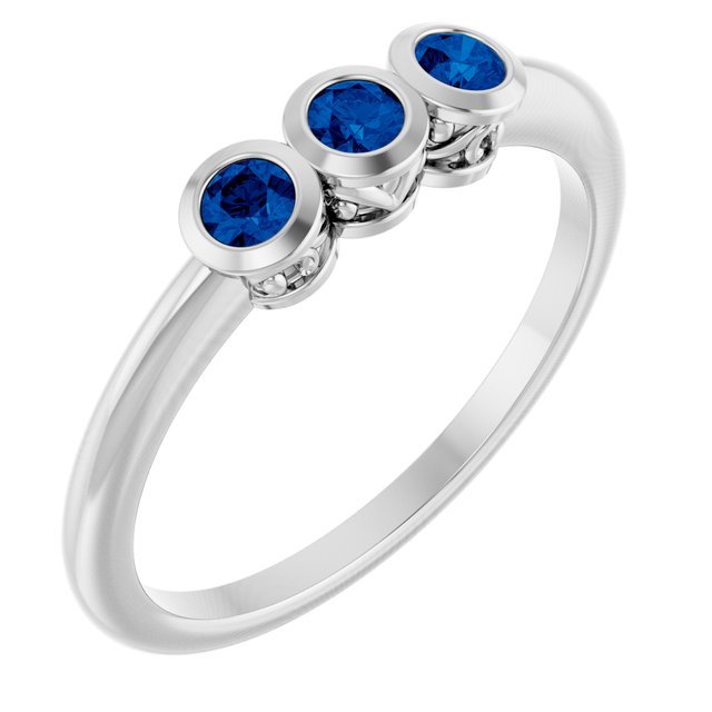Round Blue Sapphire Three Stone Ring in Platinum
