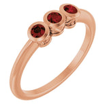 Round Mozambique Garnet Three Stone Ring in Rose Gold