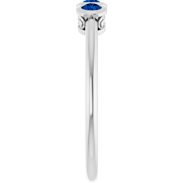 Round Blue Sapphire Three Stone Ring in Platinum