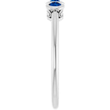 Round Blue Sapphire Three Stone Ring in Platinum