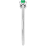 Round Emerald Three Stone Ring in Platinum