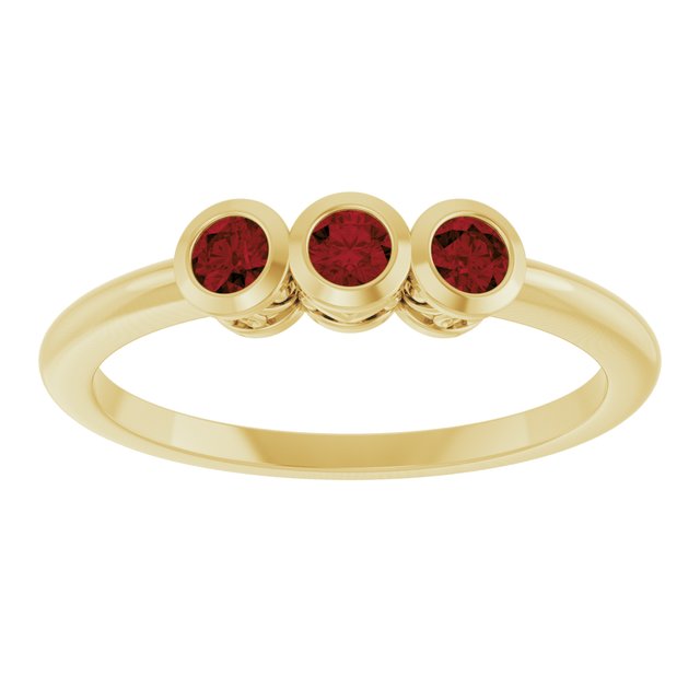 Round Mozambique Garnet Three Stone Ring in Yellow Gold
