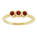 Round Mozambique Garnet Three Stone Ring in Yellow Gold