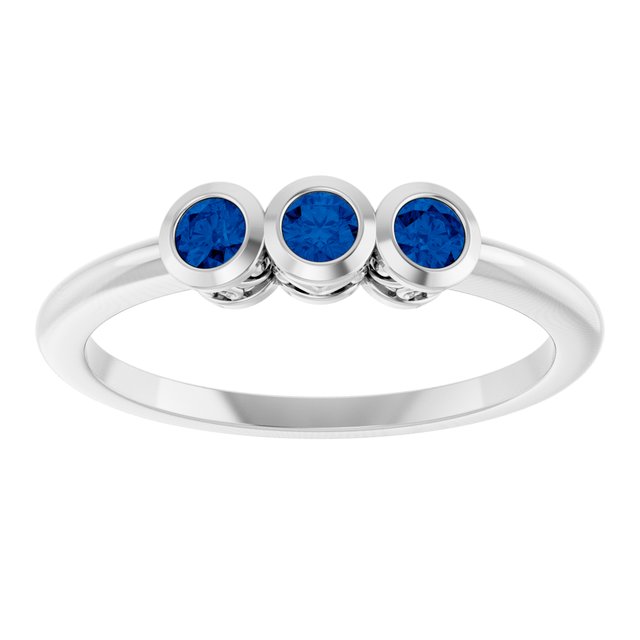 Round Blue Sapphire Three Stone Ring in Platinum