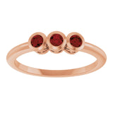Round Mozambique Garnet Three Stone Ring in Rose Gold