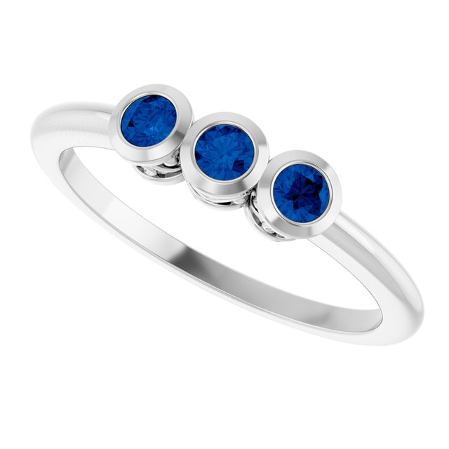 Round Blue Sapphire Three Stone Ring in Platinum
