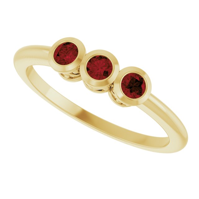Round Mozambique Garnet Three Stone Ring in Yellow Gold