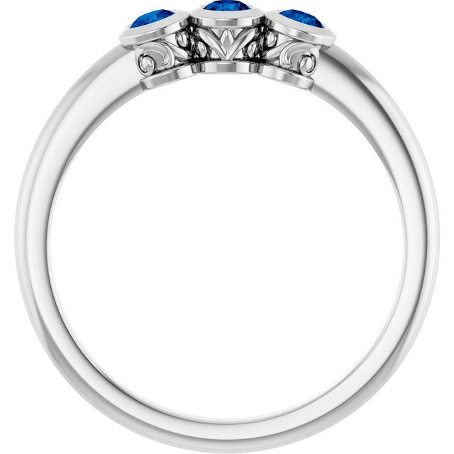 Round Blue Sapphire Three Stone Ring in Platinum