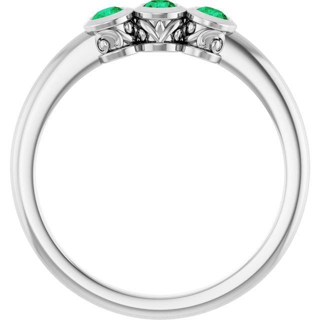 Round Emerald Three Stone Ring in Platinum