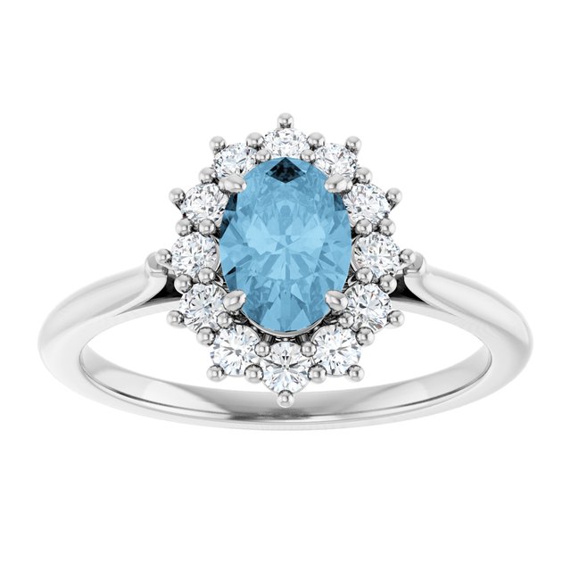 Oval Sky Blue Topaz & Diamond Halo Ring in Gold and Platinum