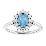 Oval Sky Blue Topaz & Diamond Halo Ring in Gold and Platinum