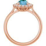 Oval Swiss Blue Topaz & Diamond Halo Ring in Gold and Platinum