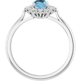 Oval Sky Blue Topaz & Diamond Halo Ring in Gold and Platinum