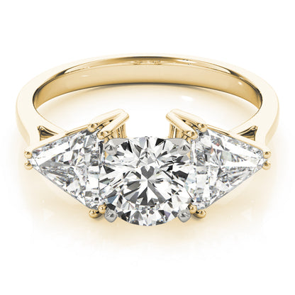 Gold ring with three diamond stones on a white background
