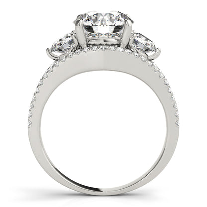 A diamond ring with a white gold band 