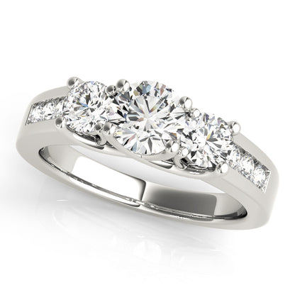 A diamond ring with three prominent stones 