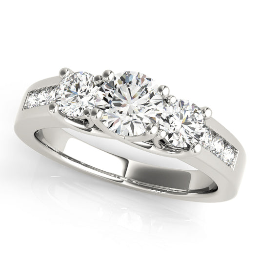 A diamond ring with three prominent stones 