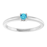 Round Blue Zircon Solitaire Ring in Gold and Platinum