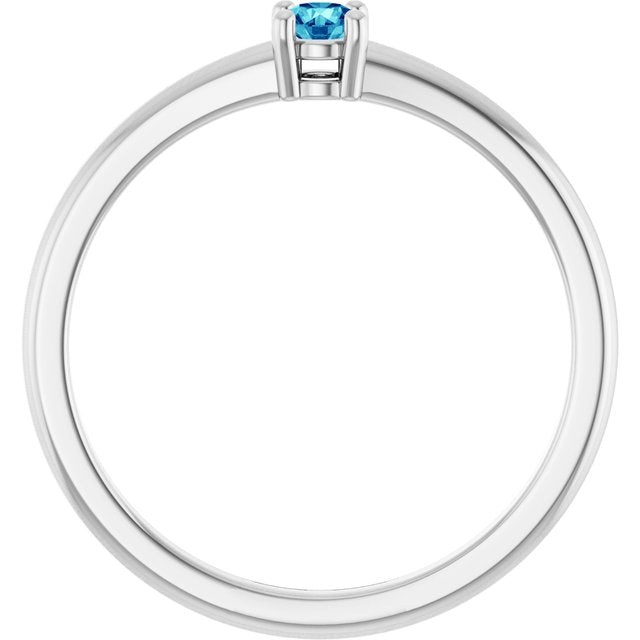 Round Blue Zircon Solitaire Ring in Gold and Platinum