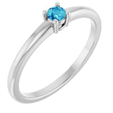 Round Blue Zircon Solitaire Ring in Gold and Platinum