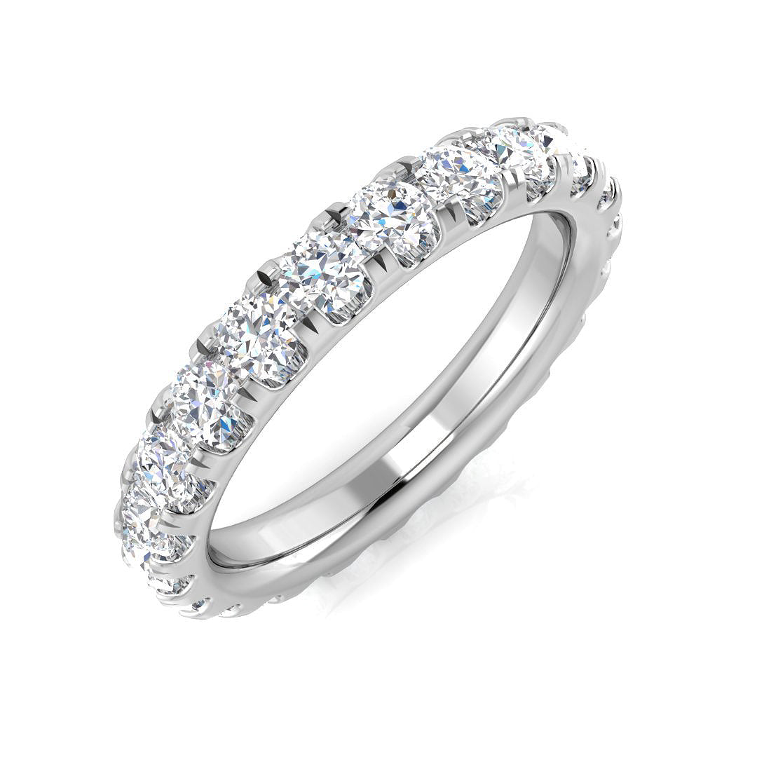Silver ring with clear gemstones on a white background