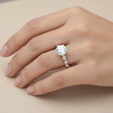 Elegant round brilliant diamond ring with alternating marquise side stones