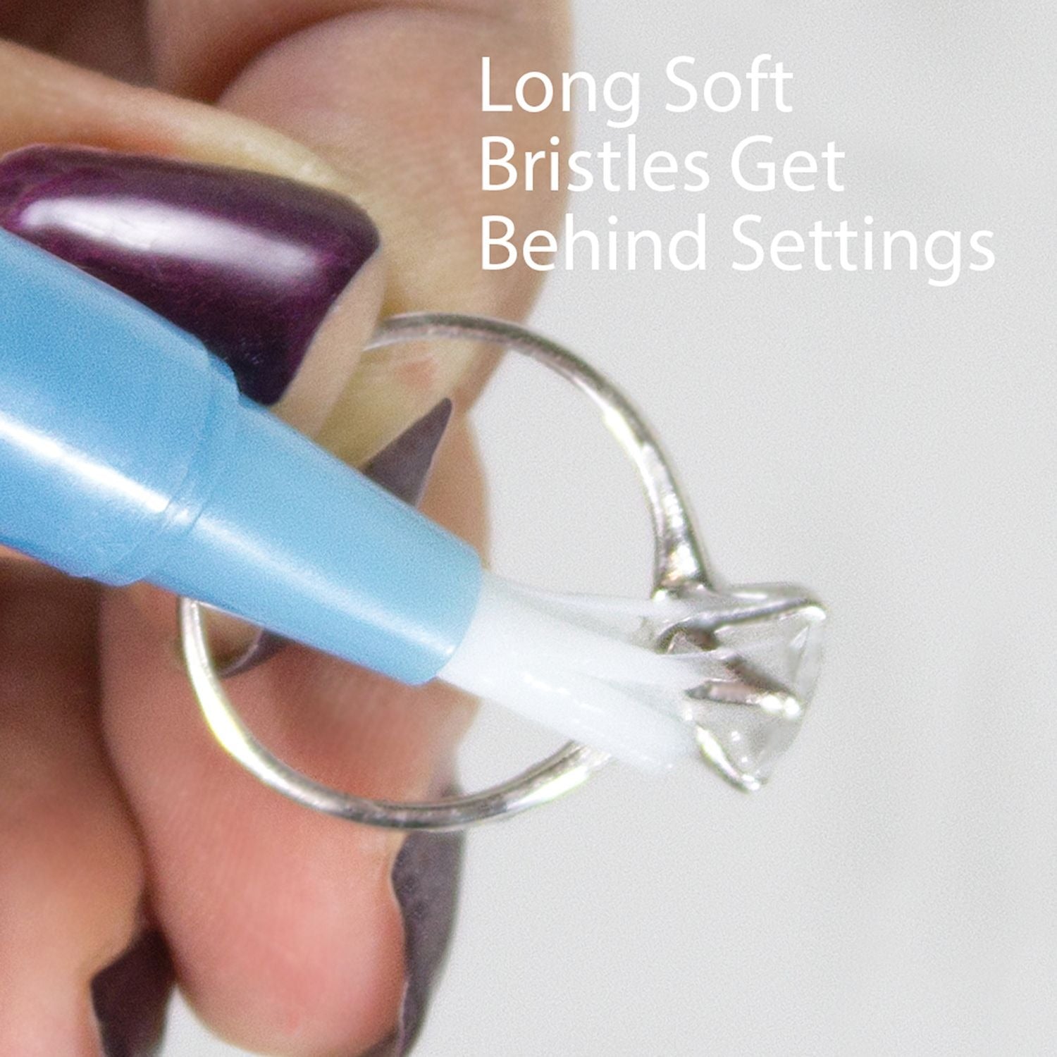 Diamond Dazzle Stick cleaning diamond ring with soft brush