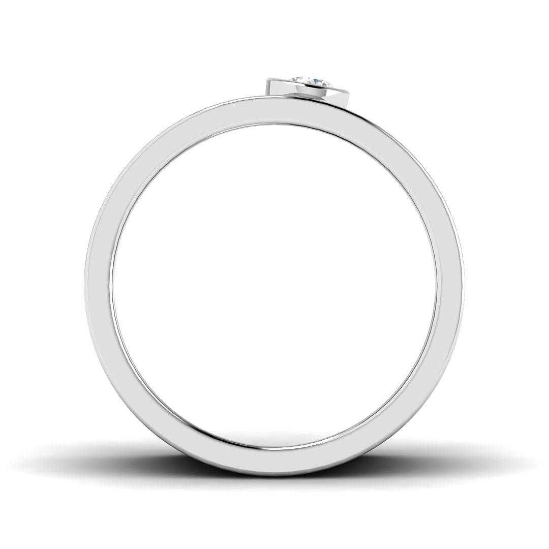 Silver ring with a small diamond on a white background