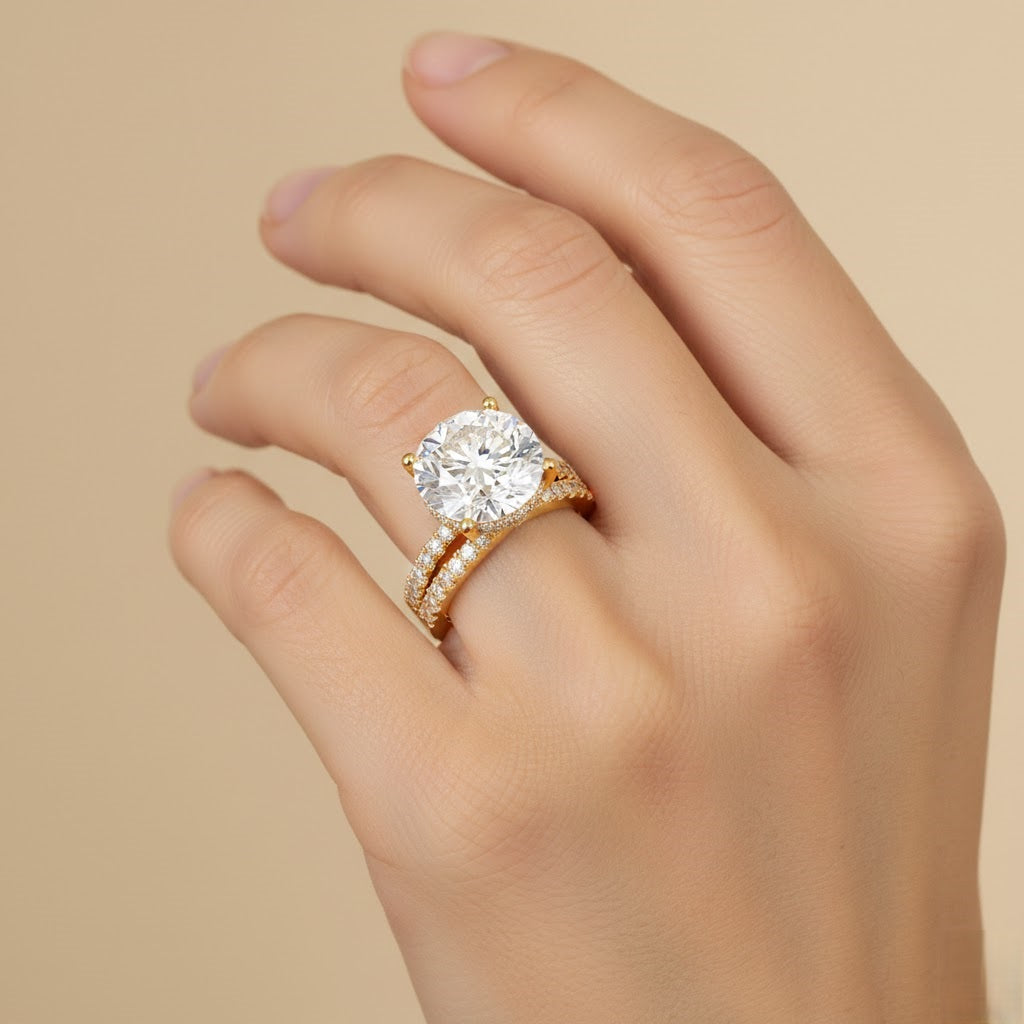 Gold ring with a large diamond on a hand against a beige background