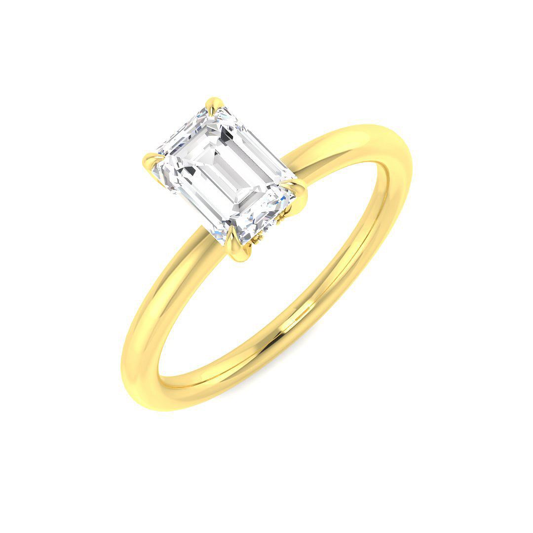 Emerald cut diamond solitaire engagement ring in yellow gold, available with natural diamond F–G color VS–SI clarity or IGI certified lab-grown diamond D color VVS clarity.