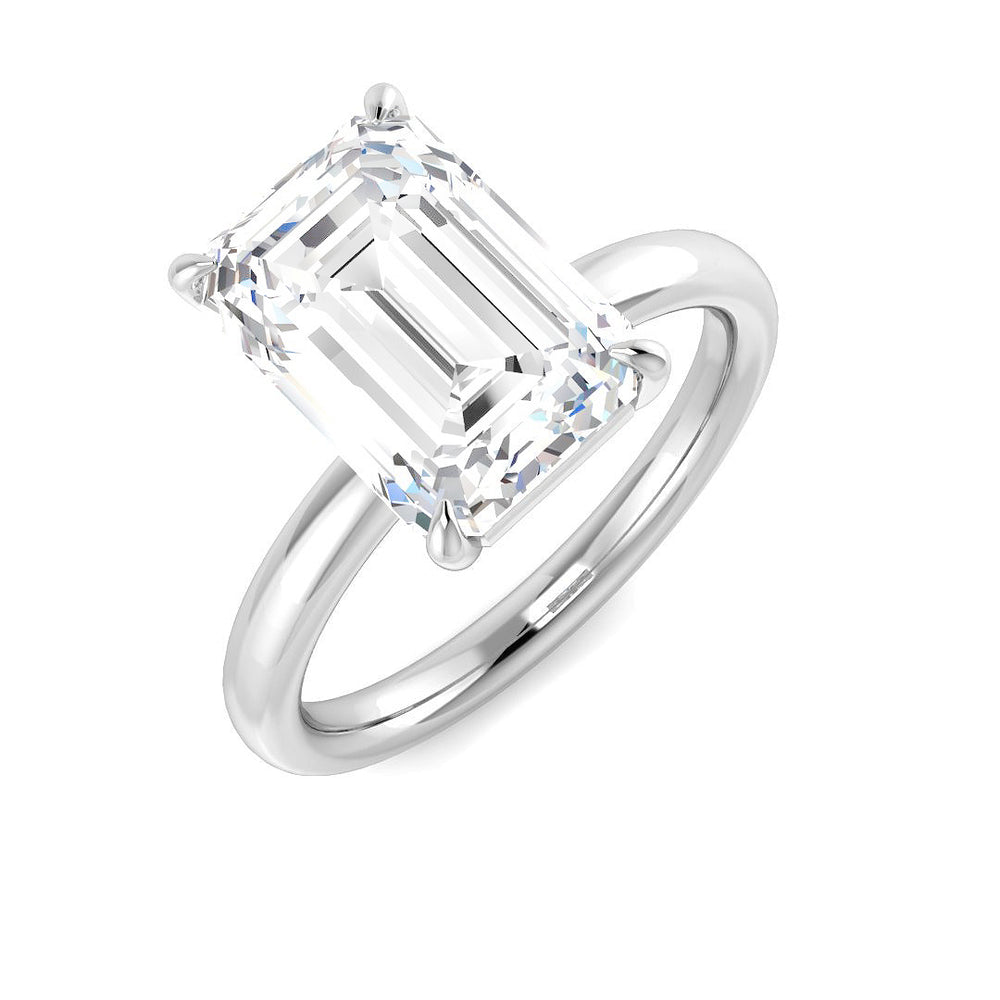 Emerald cut diamond solitaire engagement ring in white gold featuring a natural diamond F-G color VS-SI clarity or IGI certified lab grown diamond D color VVS clarity