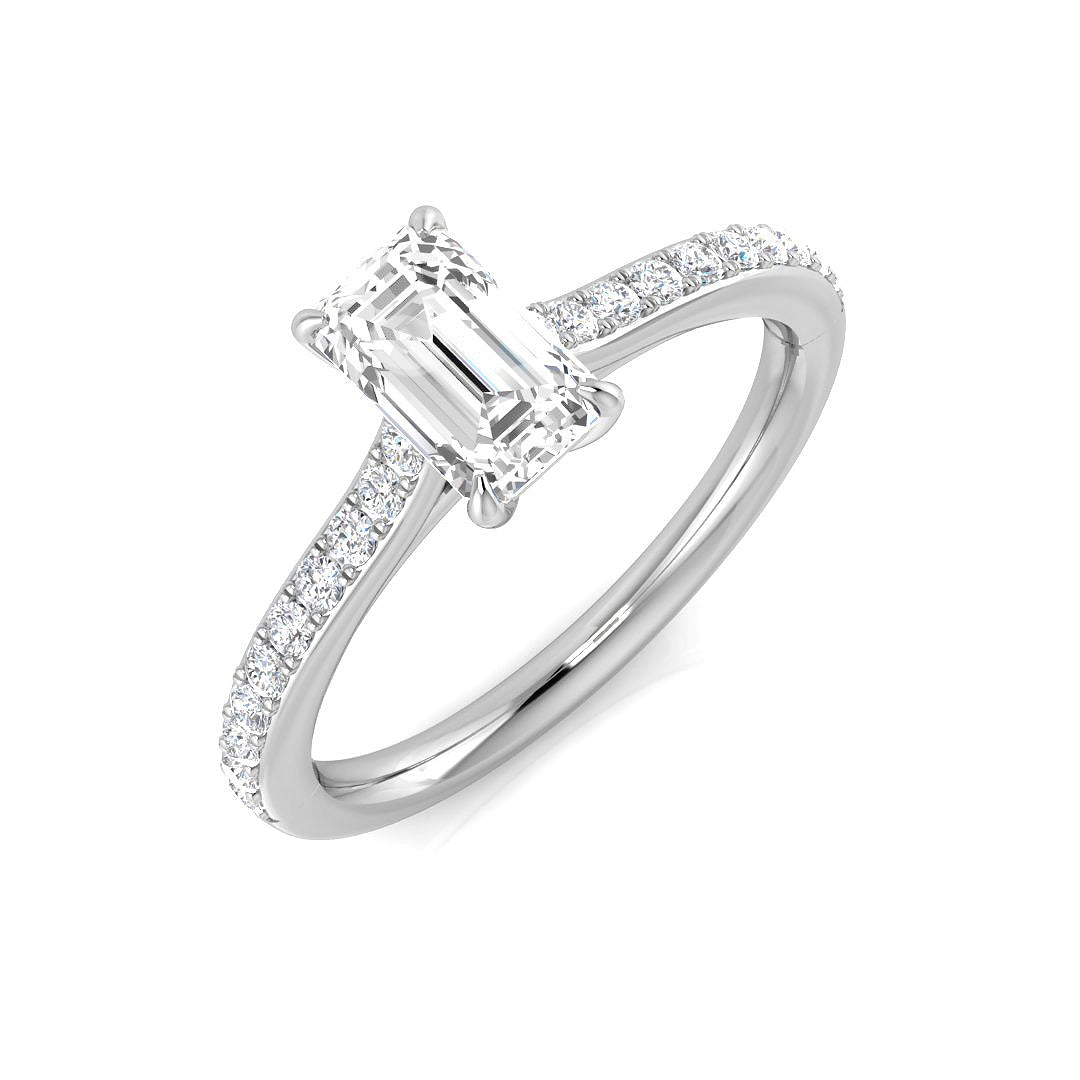 Emerald cut diamond solitaire engagement ring with pavé diamond band in white gold. Natural diamond (F–G color, VS–SI clarity) or IGI certified lab grown diamond (D color, VVS clarity).