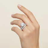 Luxury round diamond ring featuring wide pavé diamond band in white gold