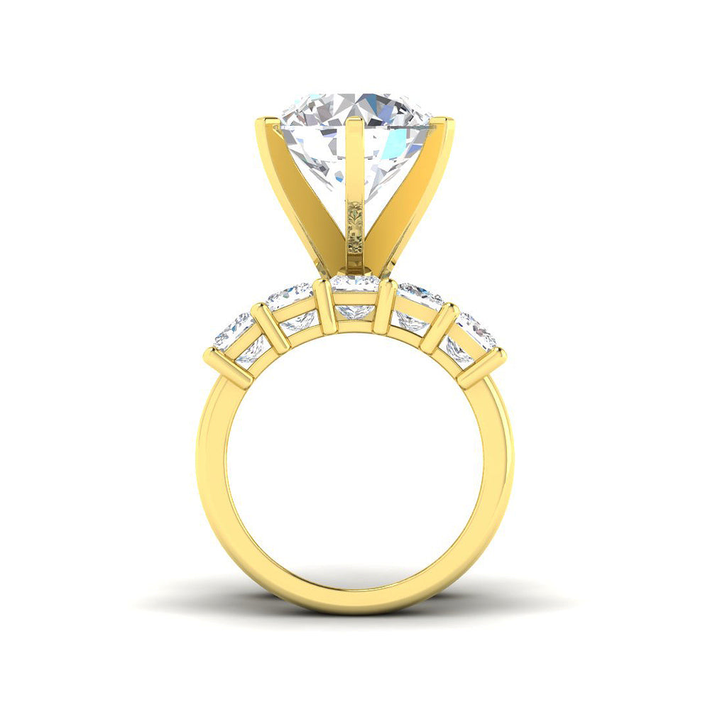 Gold ring with a large diamond and smaller stones on a white background