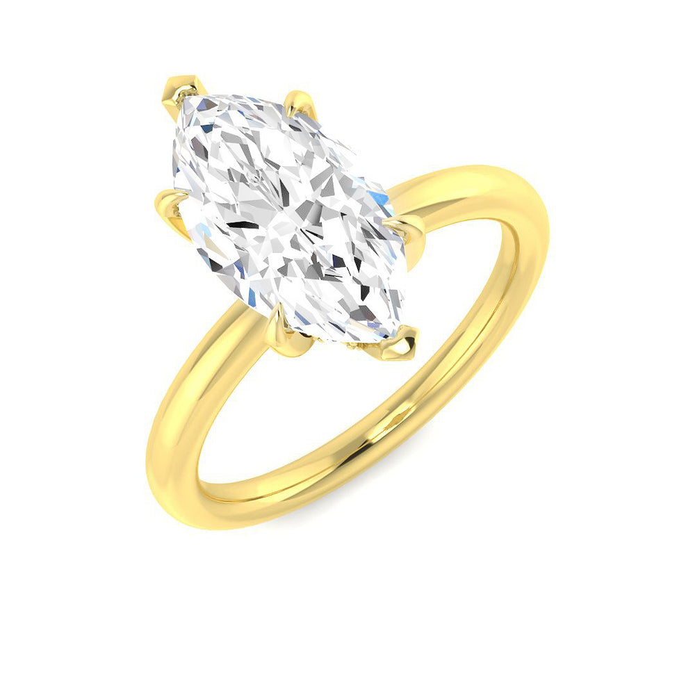 Marquise cut diamond solitaire ring in yellow gold featuring a sleek minimalist band design